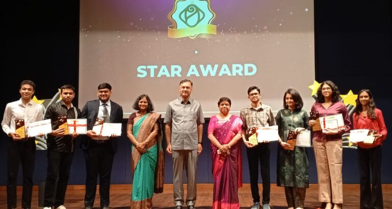 felicitation ceremony, student, student with certificate in hand, students on stage